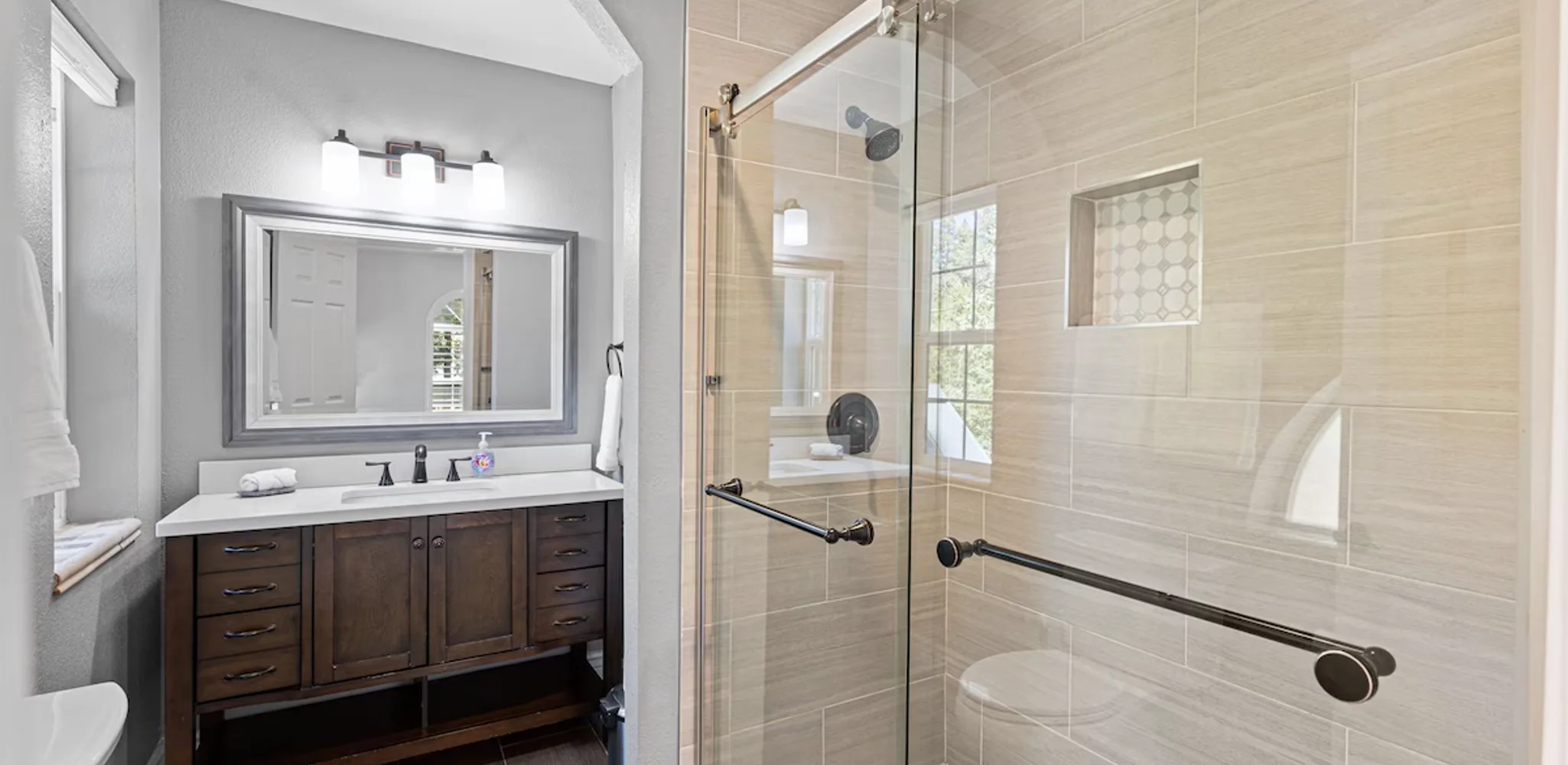 Master bathroom with a walk-in shower and a double vanity