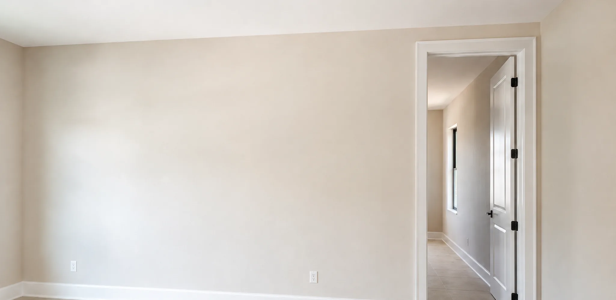 Freshly painted white walls and trim in an empty room, interior and exterior painting