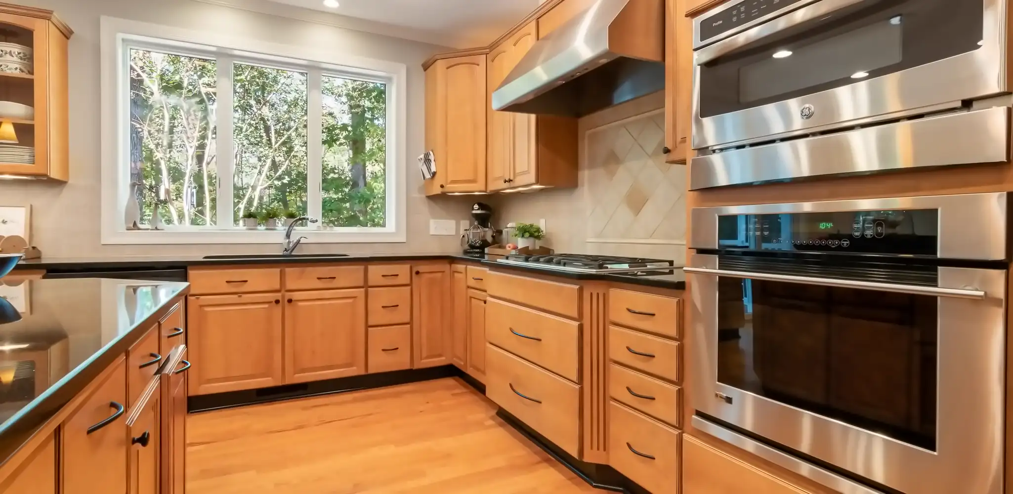 Wood cabinets and stainless steel appliances in a kitchen, cabinet installation