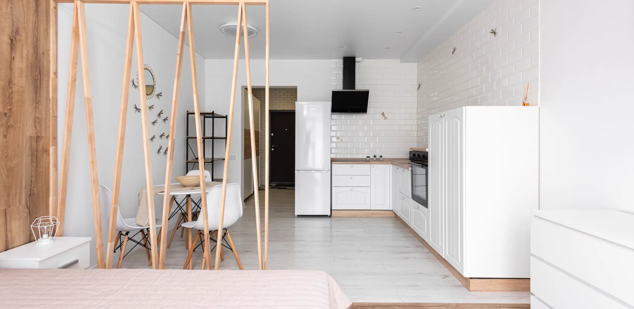 A studio apartment with an open kitchen, garage conversion