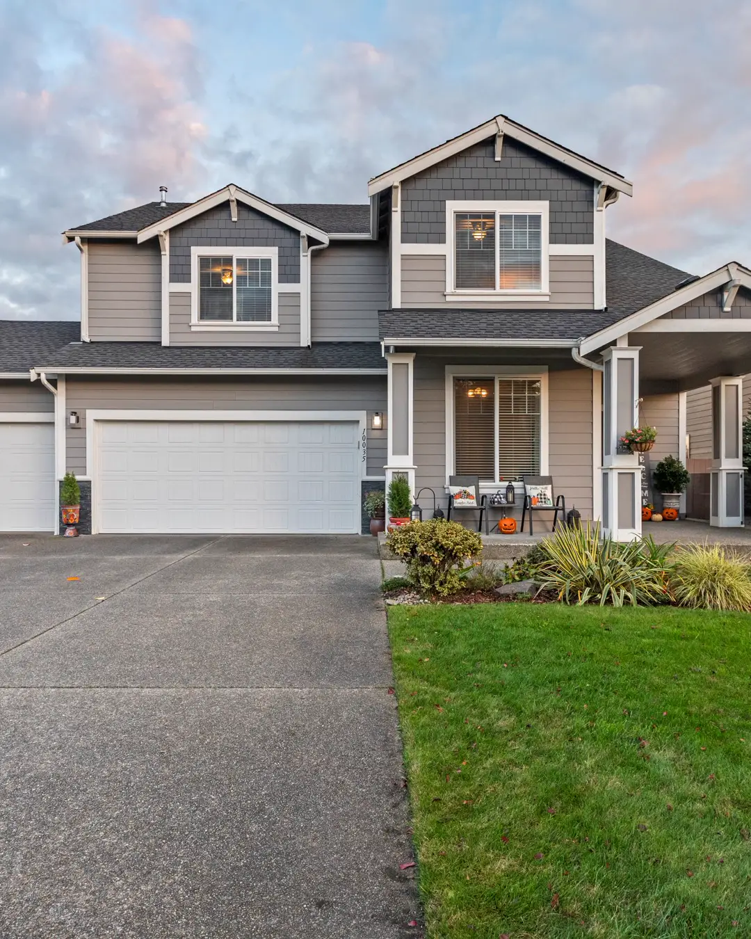 A house with a wide driveway and a two car garage, driveway cost