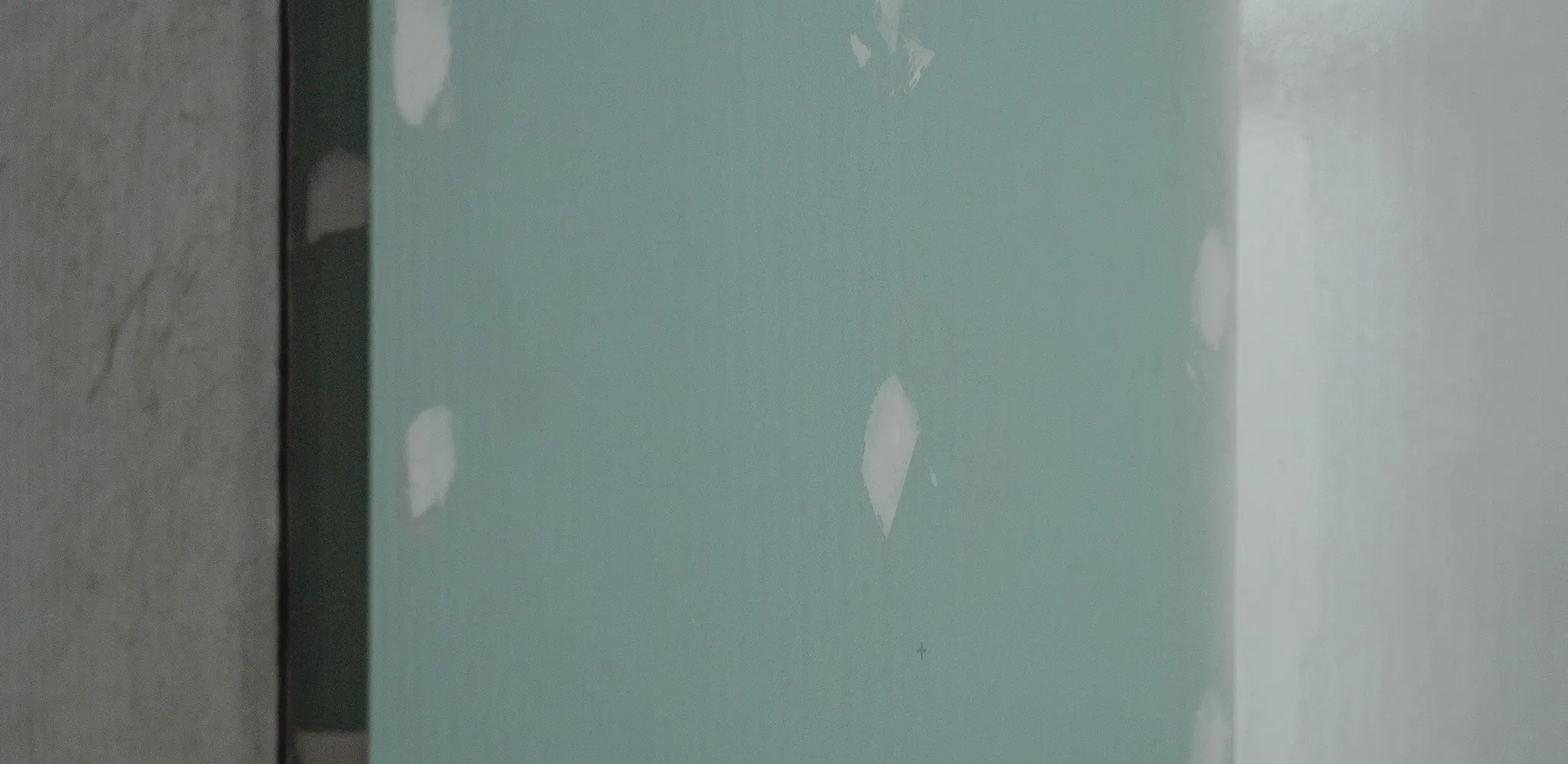 New drywall hung with taped and patched joints, drywall repair