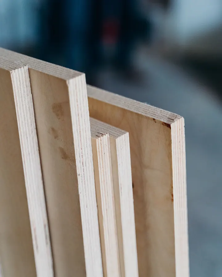 Stacked plywood sheets on edge, the subfloor material that goes under a new floor