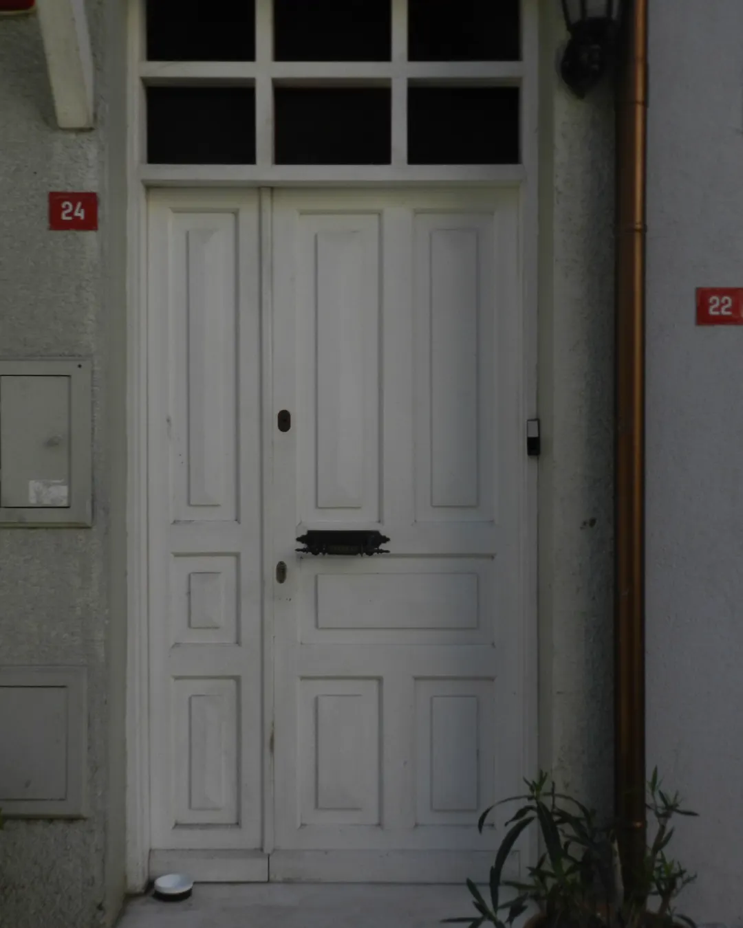 A white panel front door with the house number beside it, front door replacement