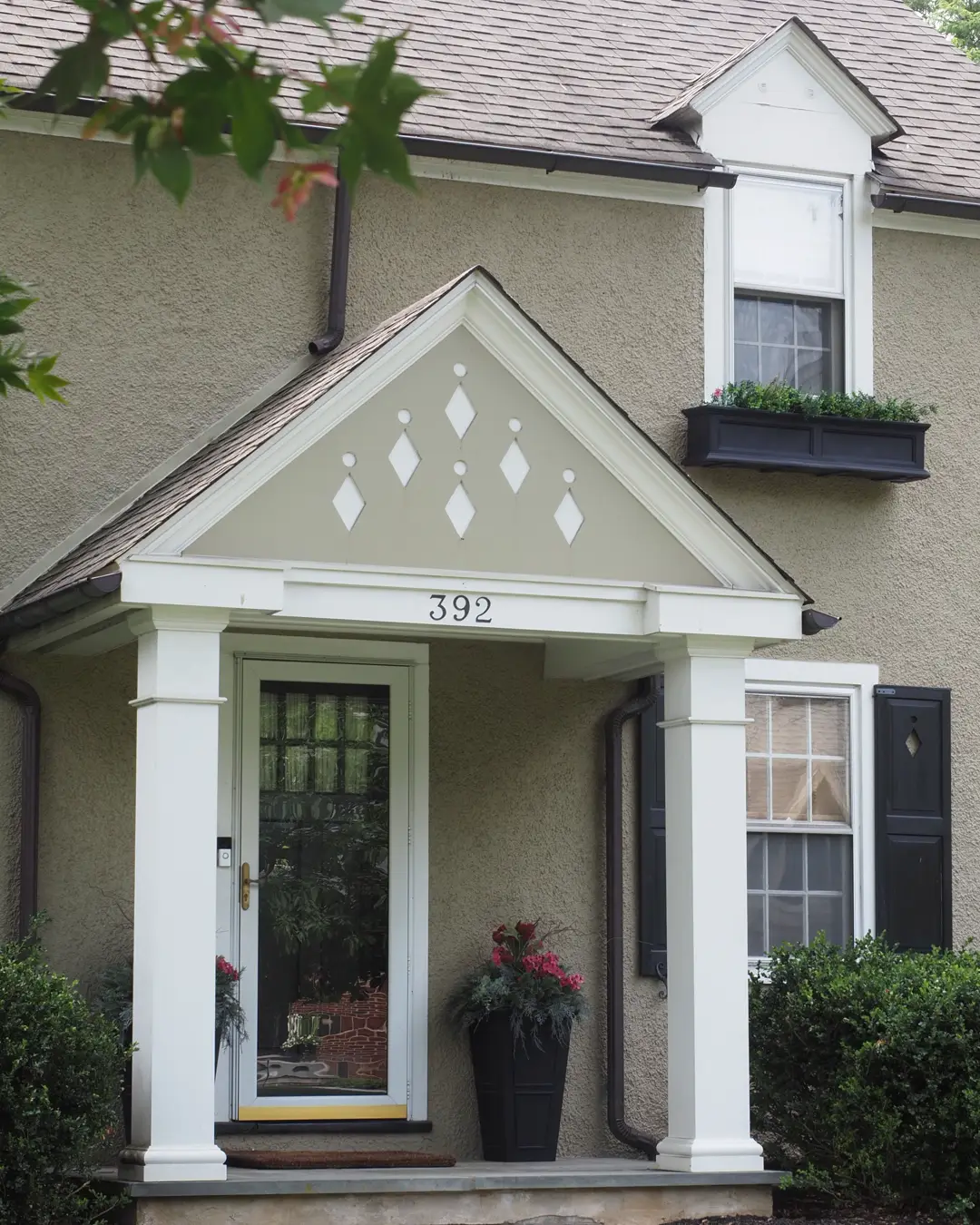The front entrance of a house with a walkway, porch and landscaping, front of house remodel