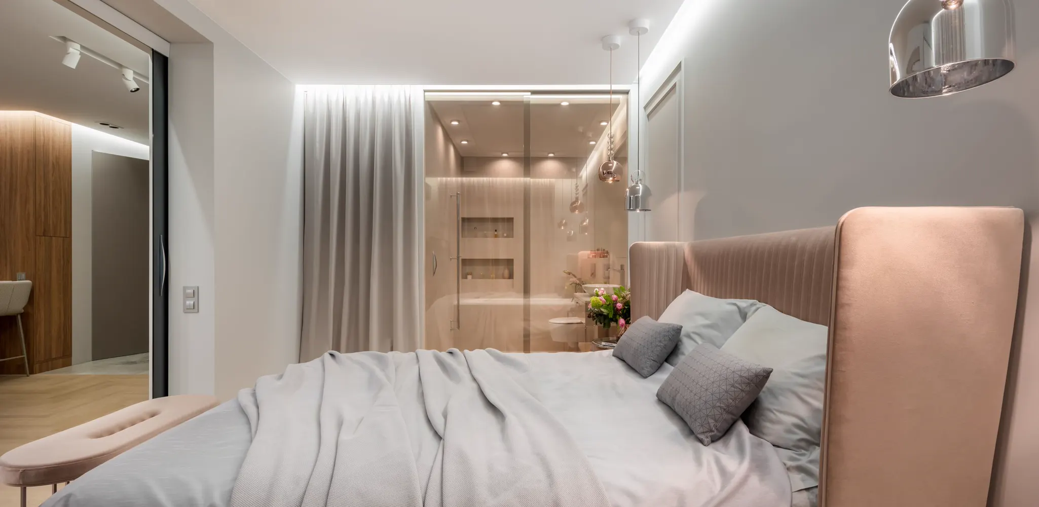 A bright bedroom with a bed, white walls and a window, in-law suite conversion