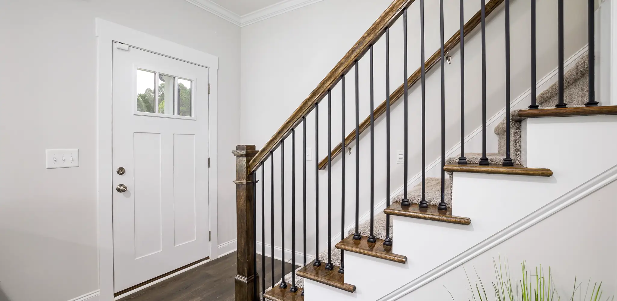 A white interior door and staircase with painted trim, interior door replacement