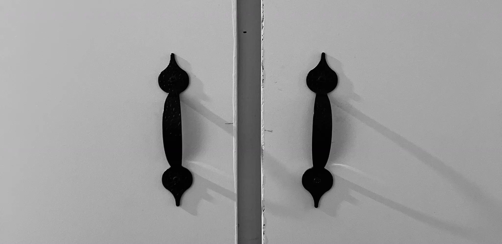 Close up of new white cabinet doors and black handles, cabinet door replacement