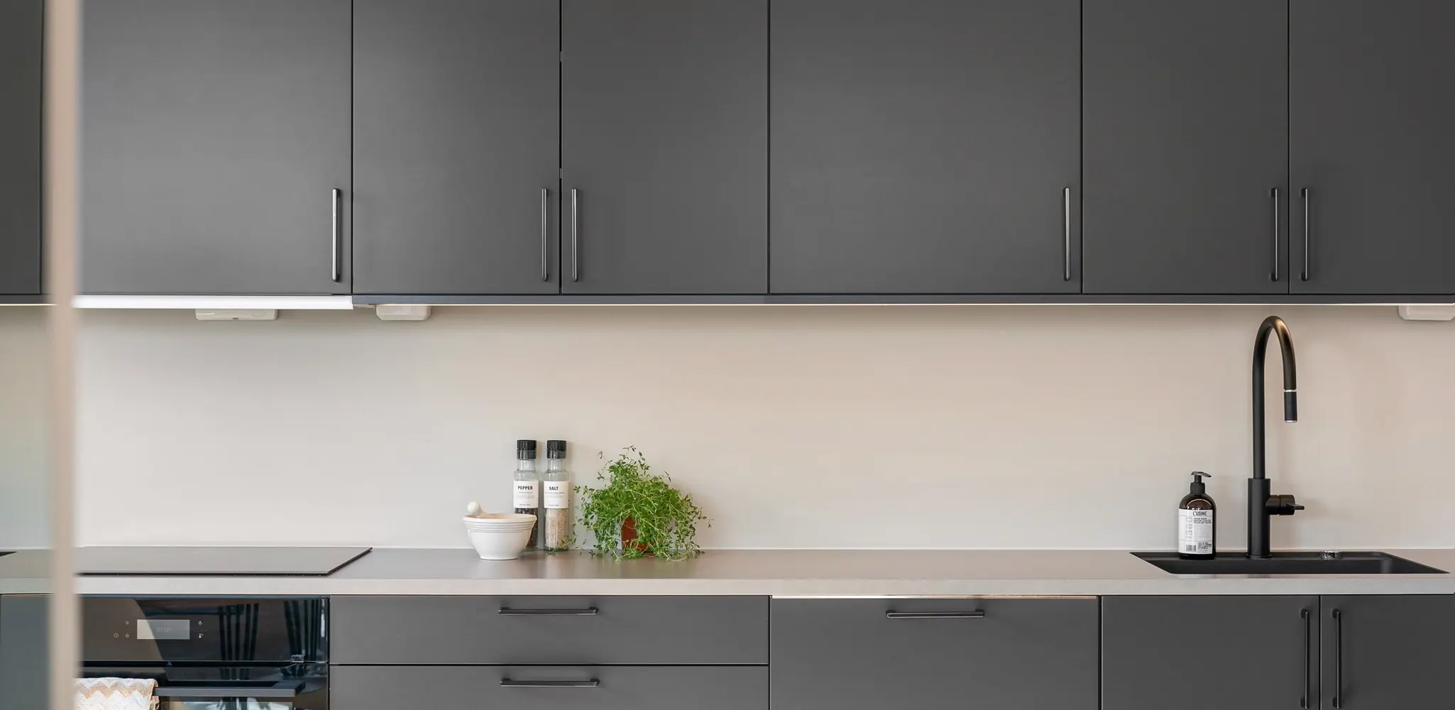 Gray slab cabinet fronts and new handles, kitchen cabinet refacing