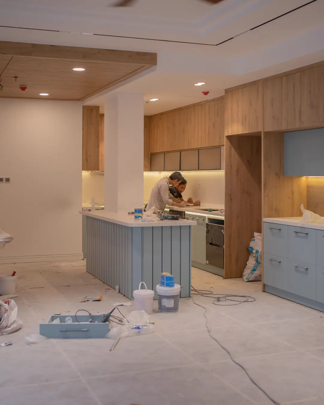 A kitchen mid remodel with a new island and cabinets still being fitted, kitchen remodel cost