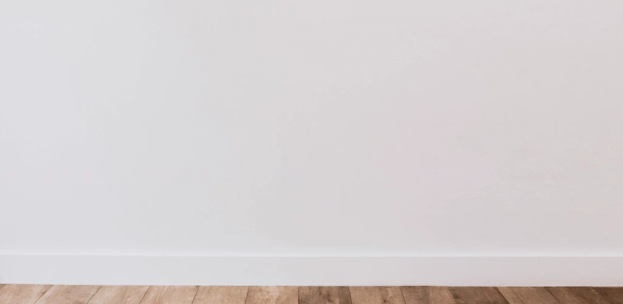 Wood look vinyl plank floor against a white wall, luxury vinyl plank flooring