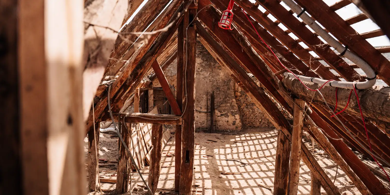 Interior view of wooden framing and rafters, soffit and fascia repair