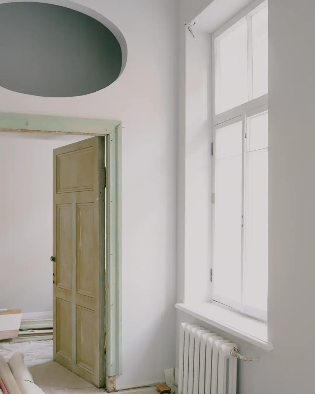 An empty room in a house during renovation with new walls and a window, whole home remodel
